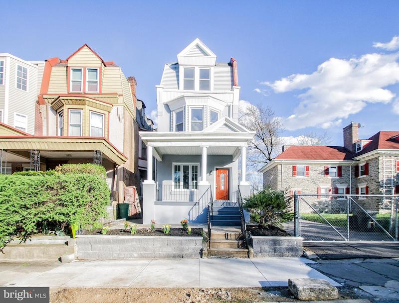 RHB Assets From IGX: Charming Philadelphia rowhouse with red brick facade and white trim.