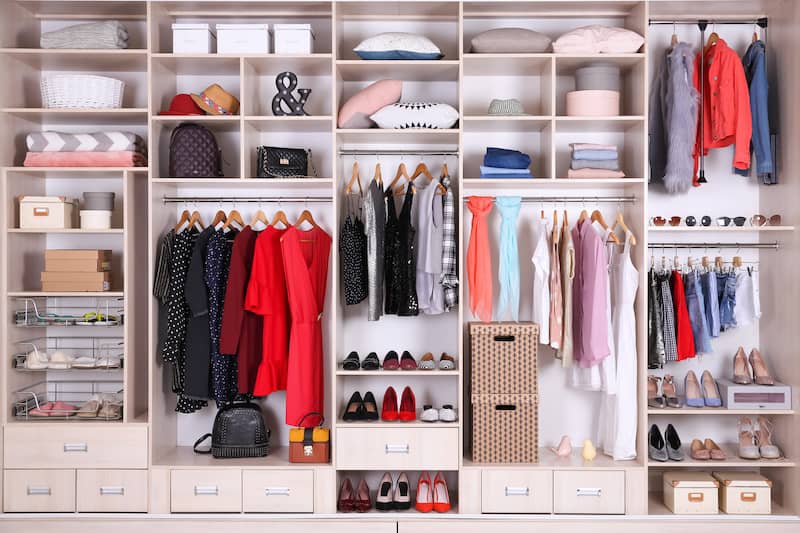 RHB Assets From IGX: Well-sorted walk-in closet with organized clothing and accessories.