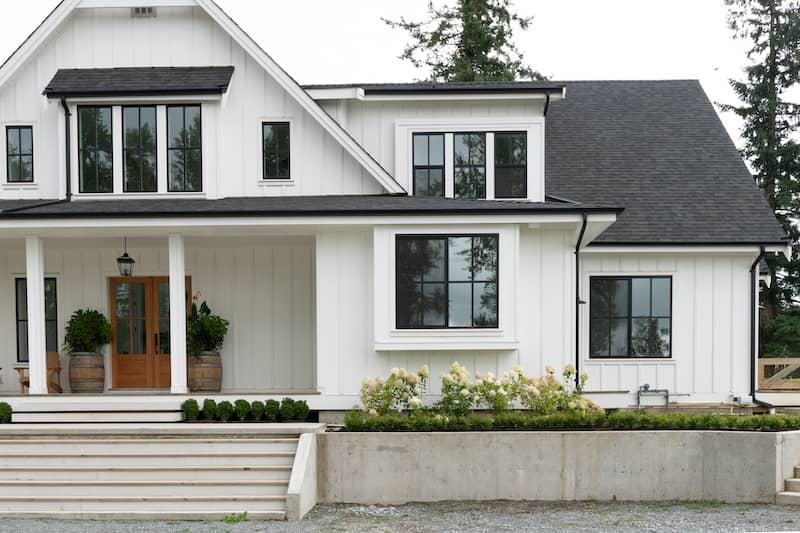 White modern farmhouse style home with black trim.