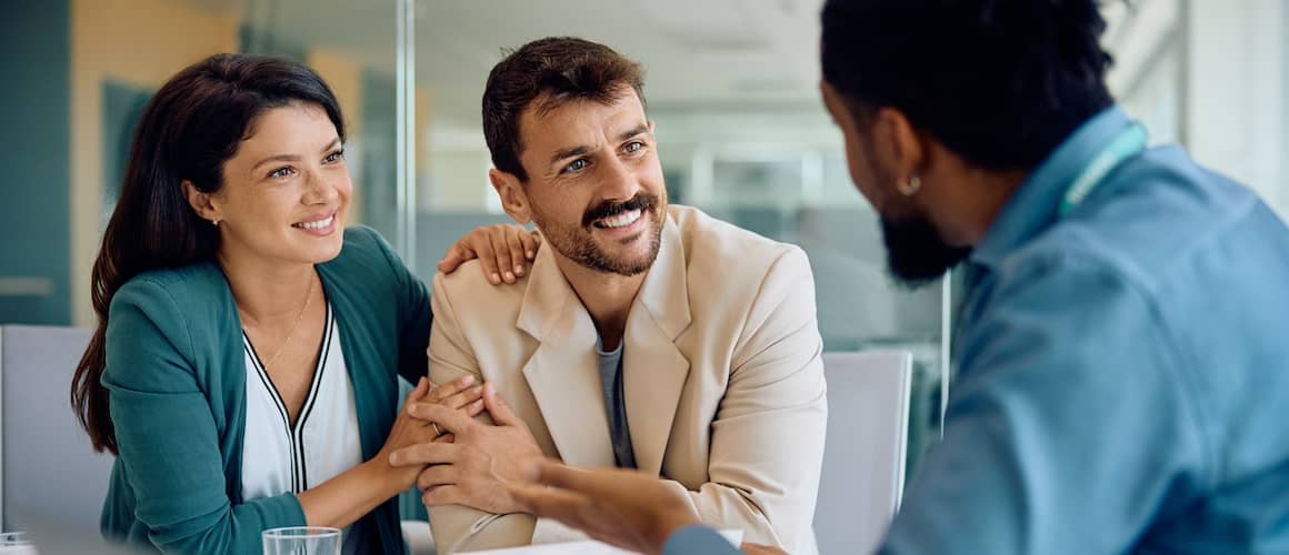 Couple meeting with their financial advisor.