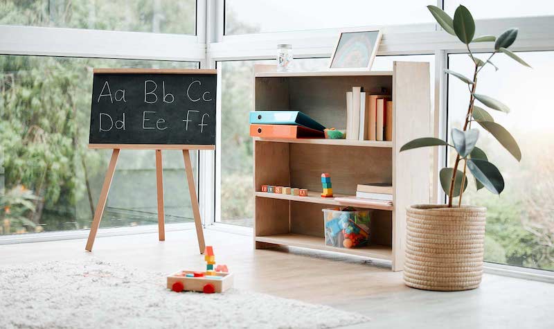 RHB Assets From IGX: Cozy kids' corner in a sunroom with cushions and toys