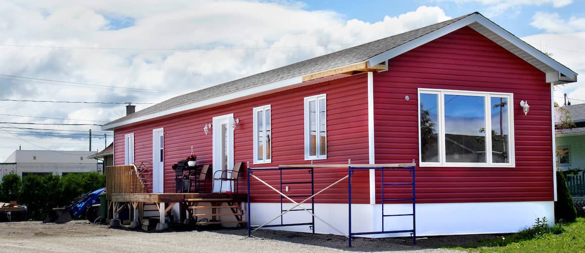 Red mobile home, depicting a mobile home painted in red.