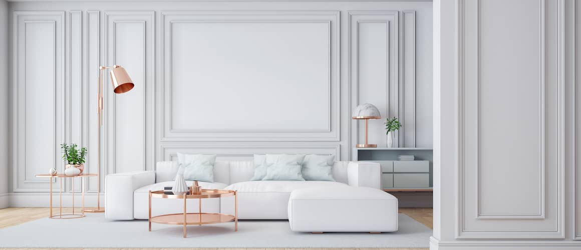 A clean white lounge with furniture depicting modern living rooms.