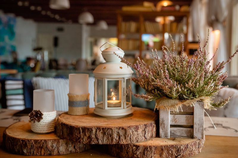 RHB Assets From IGX: Rustic wood slabs and candles as cozy cabin decor