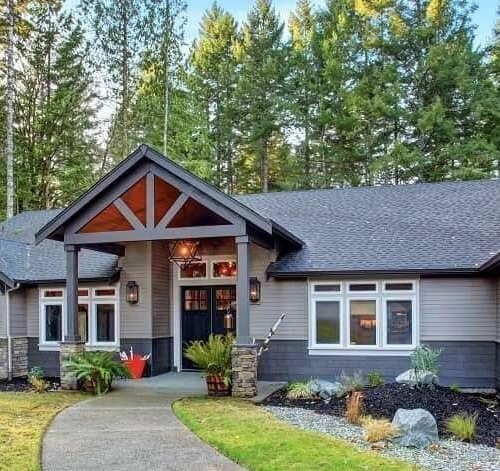 A beautiful house near woods, portraying a serene setting with nature in the background.