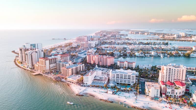 RHB Assets From IGX: Panoramic view of Clearwater Beach, Florida, with white sand and blue skies.