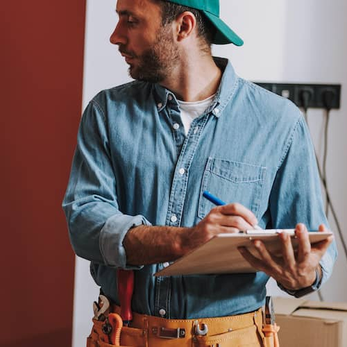 A service repairman, possibly indicating home maintenance or repair services.