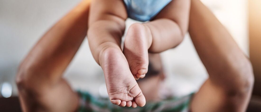 Stock-FatherHoldingBabyWithBabyFeet-iStock-1094809960-small-compressor.jpeg