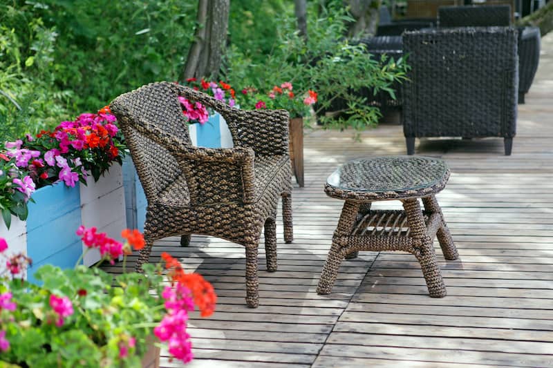 RHB Assets From IGX: Beautiful classic patio with stone floor, outdoor furniture, and green plants.