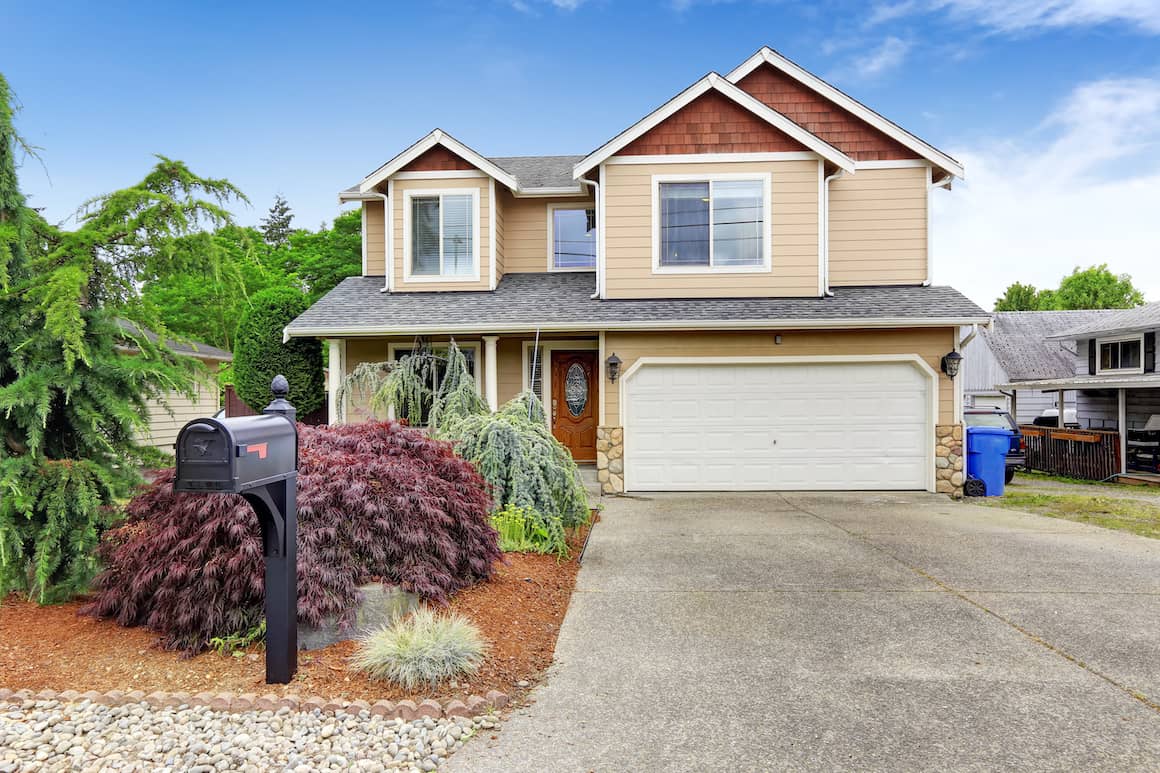 RHB Assets From IGX: Tan and auburn home exterior with a front yard