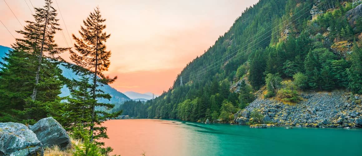 RHB Assets From IGX: Diablo Lake sunrise in Washington State with mountainous backdrop.