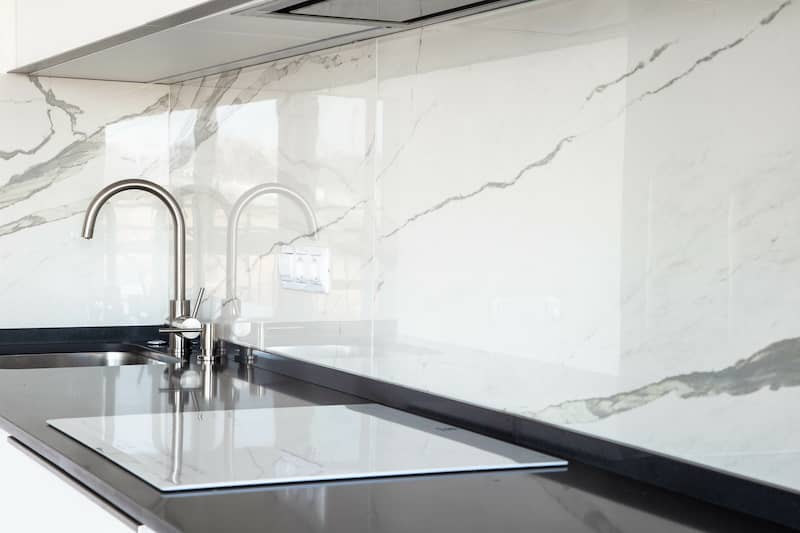 White slab marble backsplash.