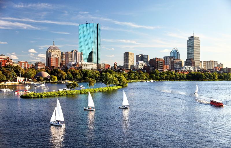 RHB Assets From IGX: Boston Harbor with sailboats and skyline in the background.