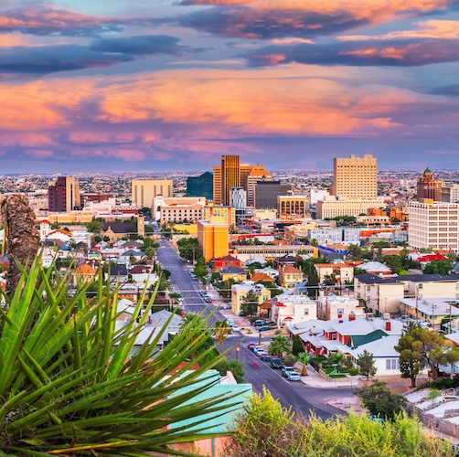 Aerial view of El Paso at sunset with pink clouds.