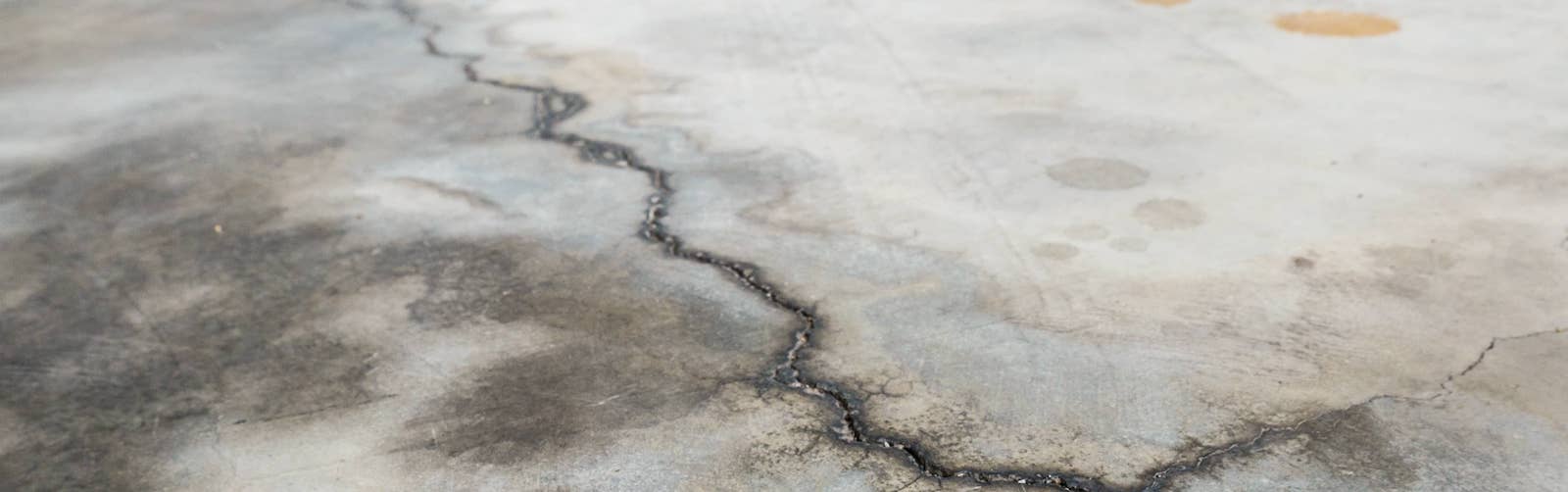 Crumbling concrete flooring under carpet - General Inspection