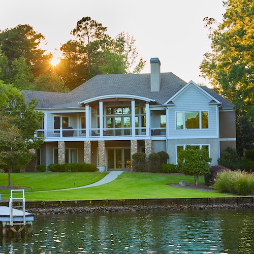 Wisconsin lake house with green grass and doc.