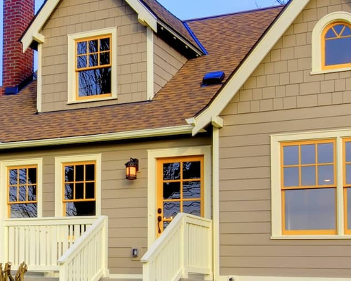 Small brown house with orange trim.