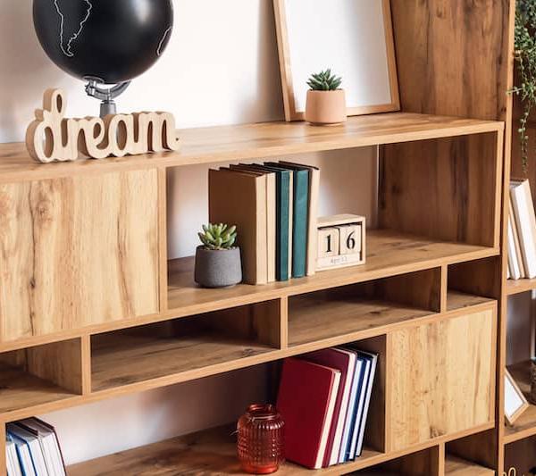 A modern shelf with books and decor on it.