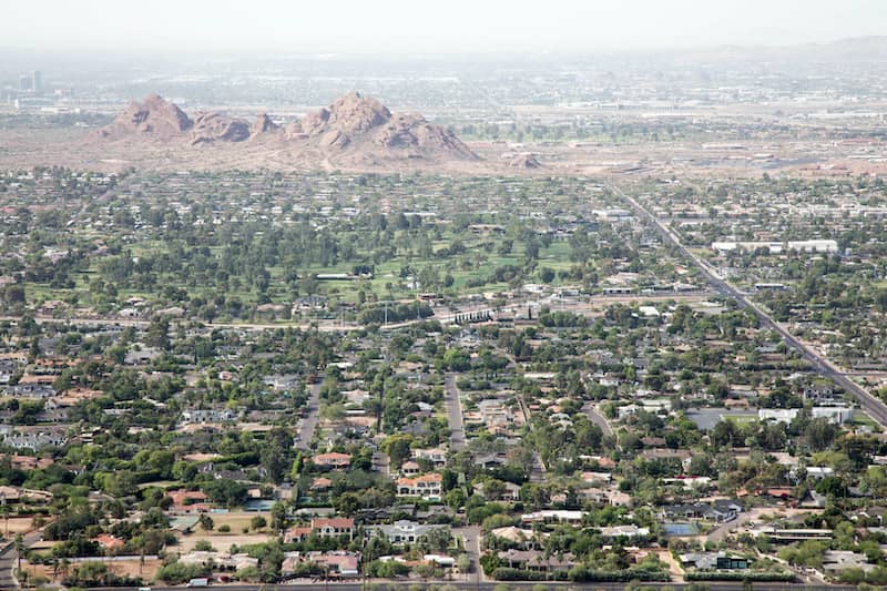 RHB Assets From IGX: Scottsdale, Arizona cityscape with palm trees and mountains in the background