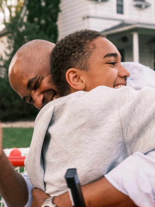 Son, Dad, embrace, hero image, outside home, hug, hugging