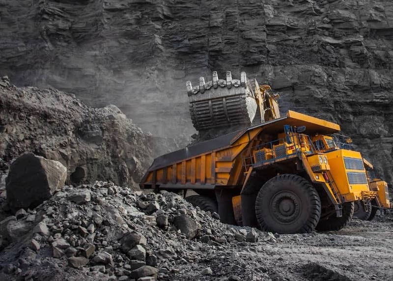 Coal mining construction using large trucks.