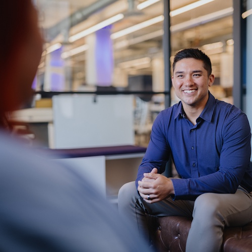Cleveland team member in a discussion with a teammate.