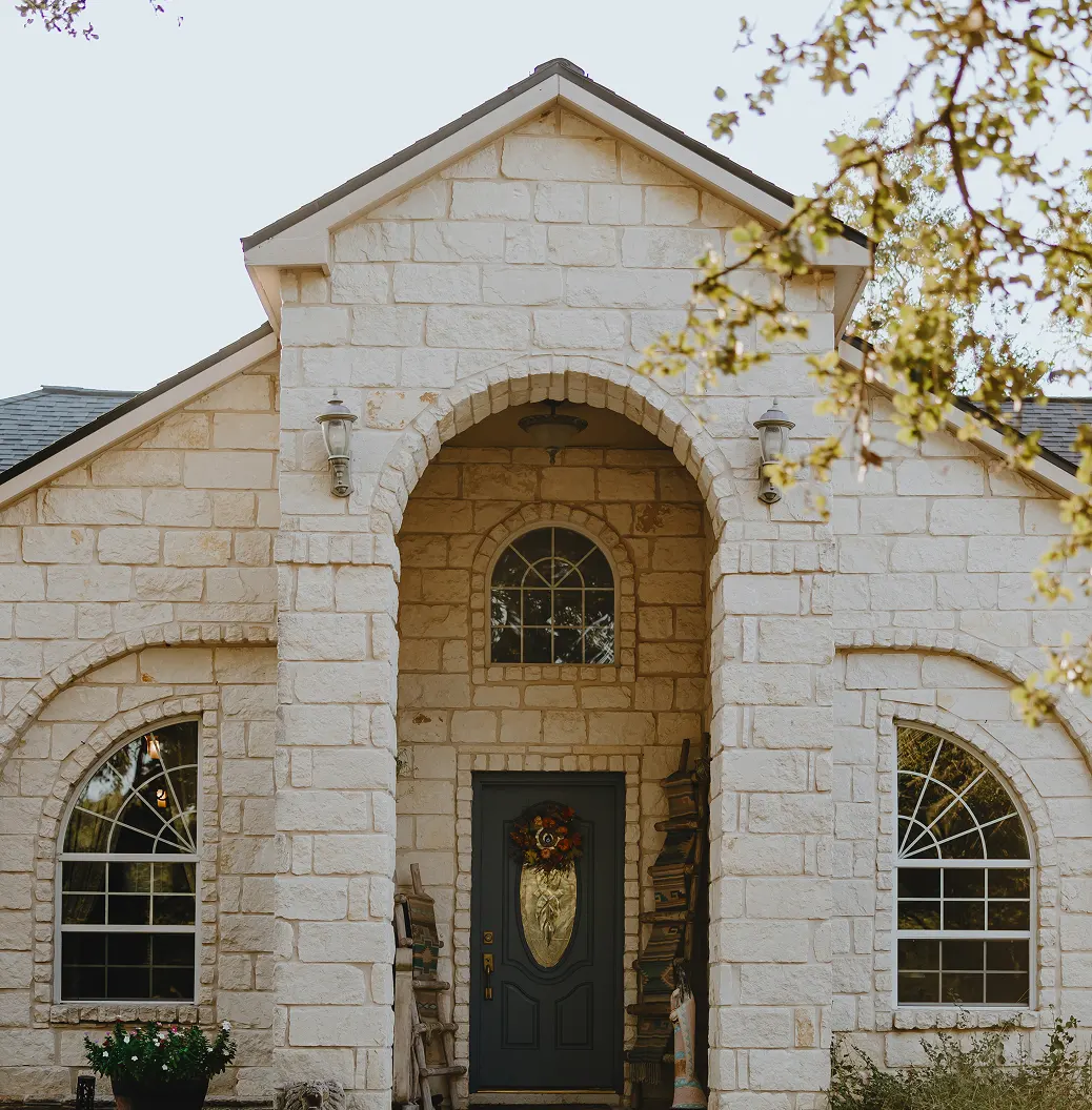 Close-up of a white brick house