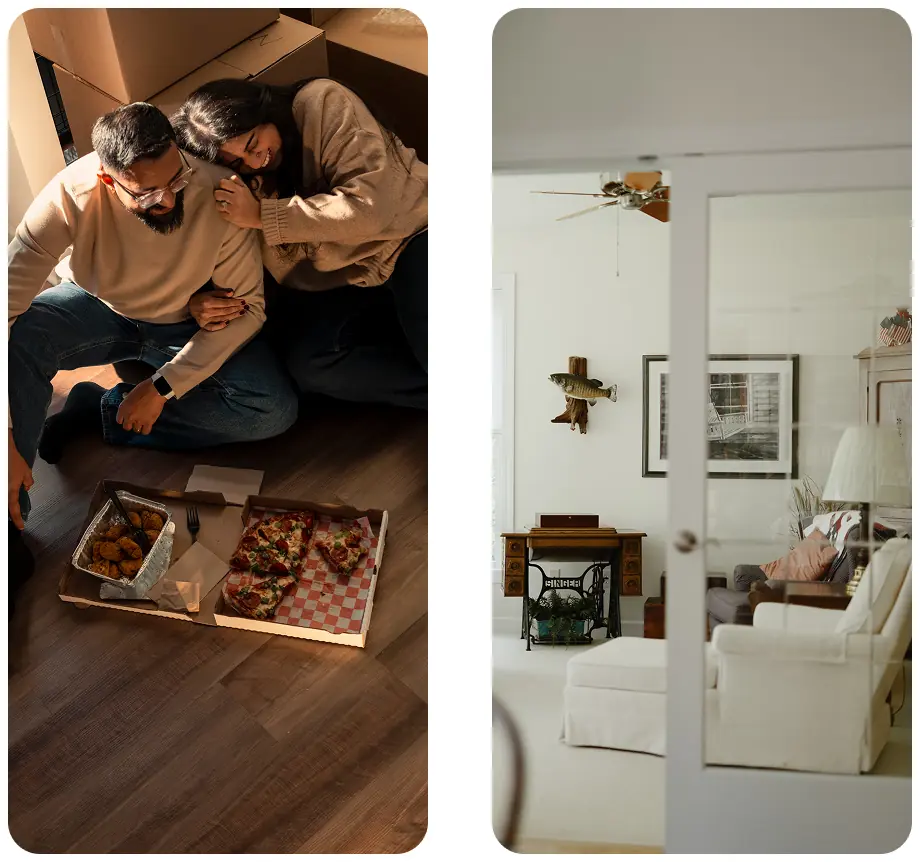Couple sharing pizza at home beside a bright living room.