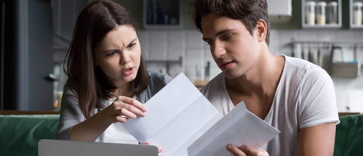 A frustrated young couple, expressing frustration or stress.