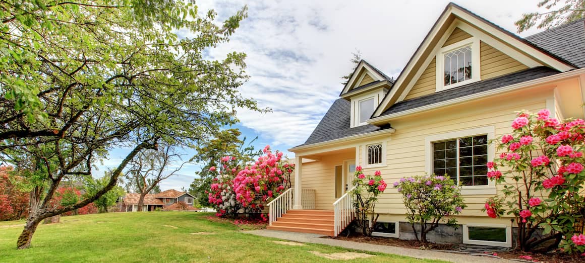 RHB Assets From IGX: Yellow house exterior with white trim and green lawn