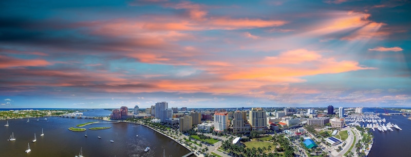 RHB Assets From IGX: Aerial view of West Palm Beach, Florida with a mix of waterways and cityscape