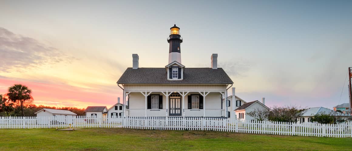 RHB Assets From IGX: Beautiful Georgian-style home with a large front porch and white columns.