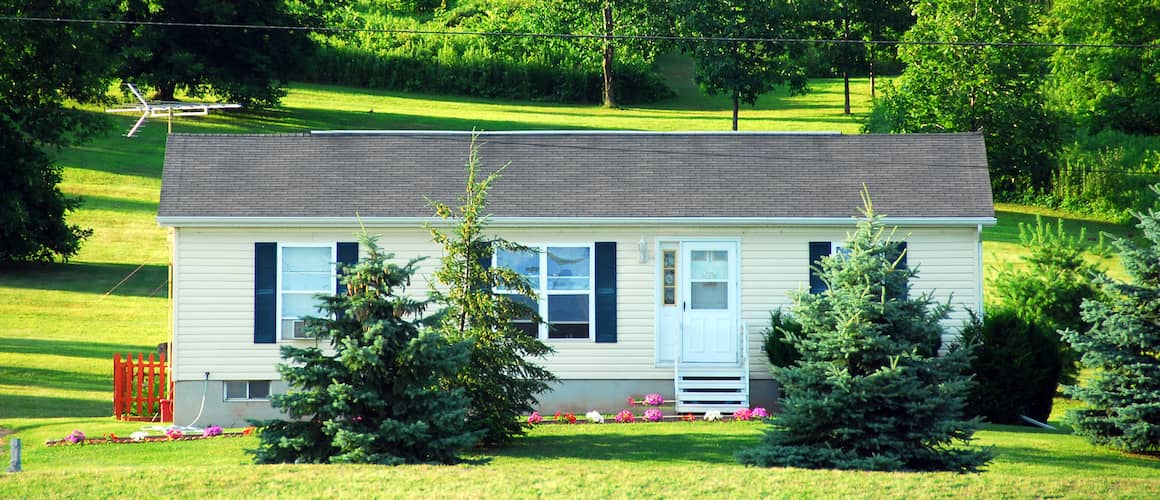 A countryside mobile home or trailer, depicting a rural housing option or alternative living arrangement.