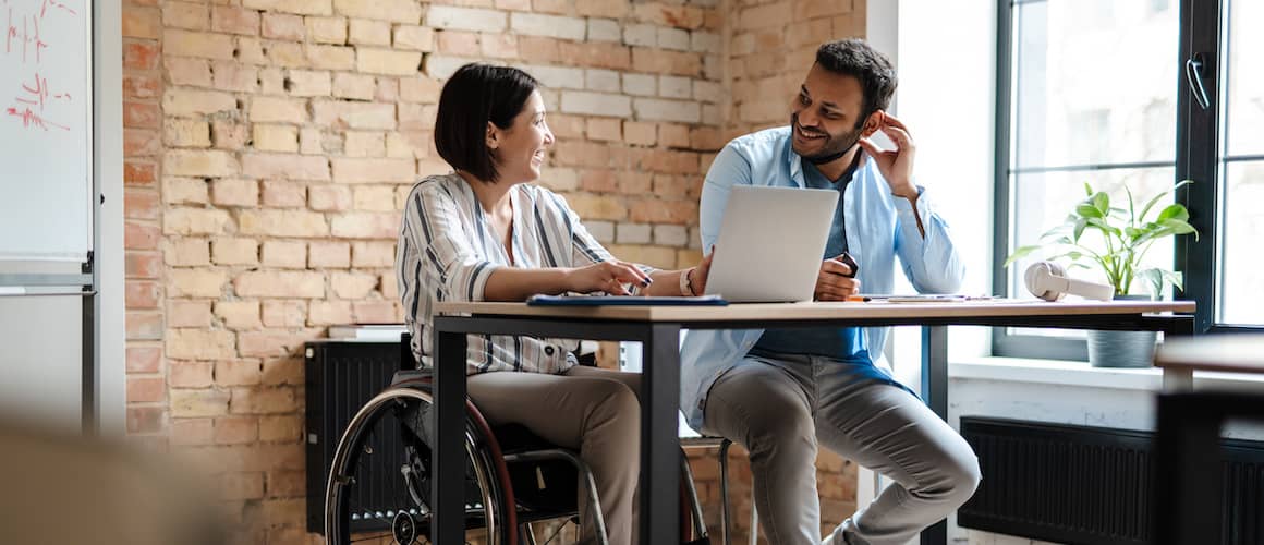 Interracial couple in wheelchair talking