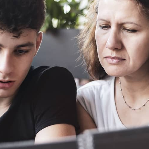 Image of parent teaching her child about loans.