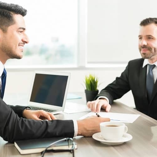 A banker discussing a loan with a couple.