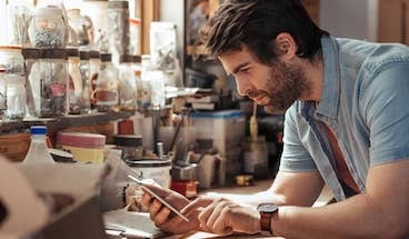 Man on phone in kitchen