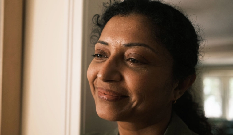 The Rocket Mortgage app makes it easy for home buyers like this smiling Indian woman to apply, get and manage their mortgage.