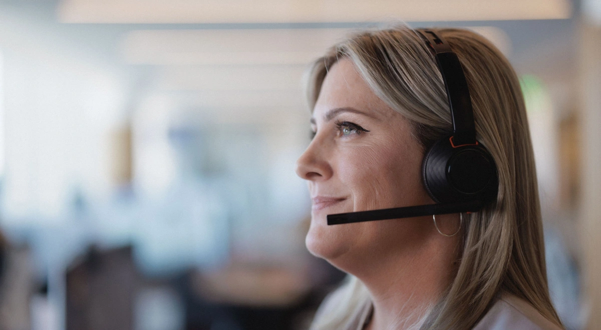 A Rocket Mortgage home loan expert wearing a headset helps a client review their mortgage.