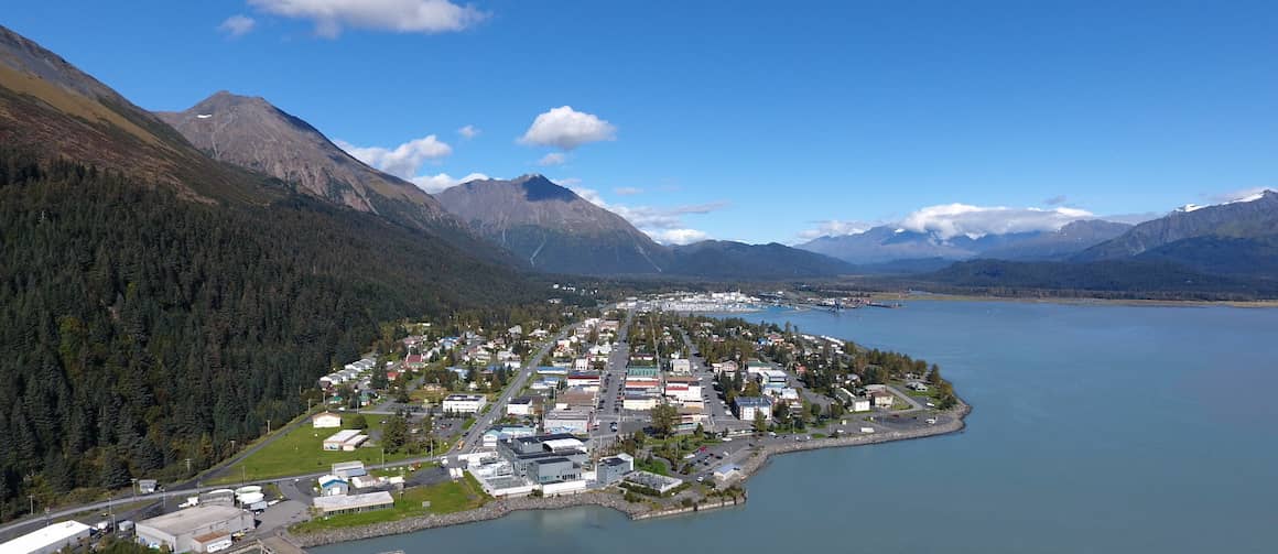 RHB Assets From IGX: Aerial view of Seward, Alaska with mountains and waterfront