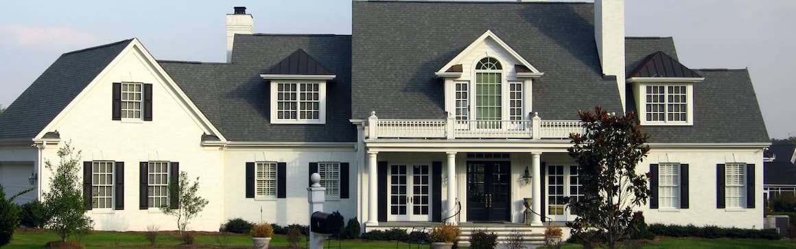 Elegant white house with contrasting black and white trim.