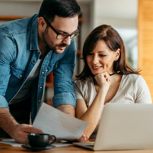A man and woman possibly discussing switching lenders or financial arrangements related to a property.