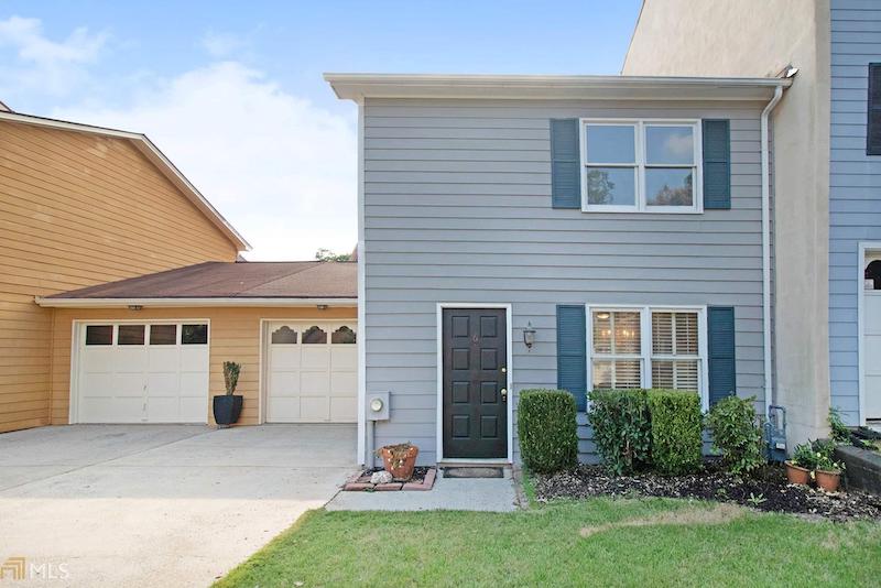 RHB Assets From IGX: Charming, traditional Decatur house with green lawn and white picket fence