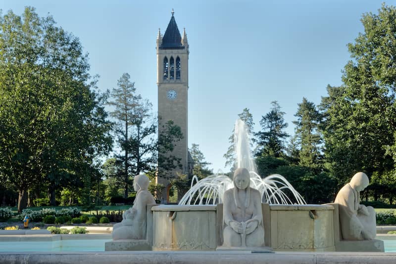 RHB Assets From IGX: Fountain of the Four Seasons sculpture surrounded by greenery.