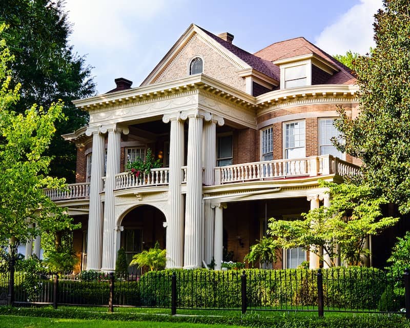 RHB Assets From IGX: Greek Revival style home with classic columns and symmetrical design.