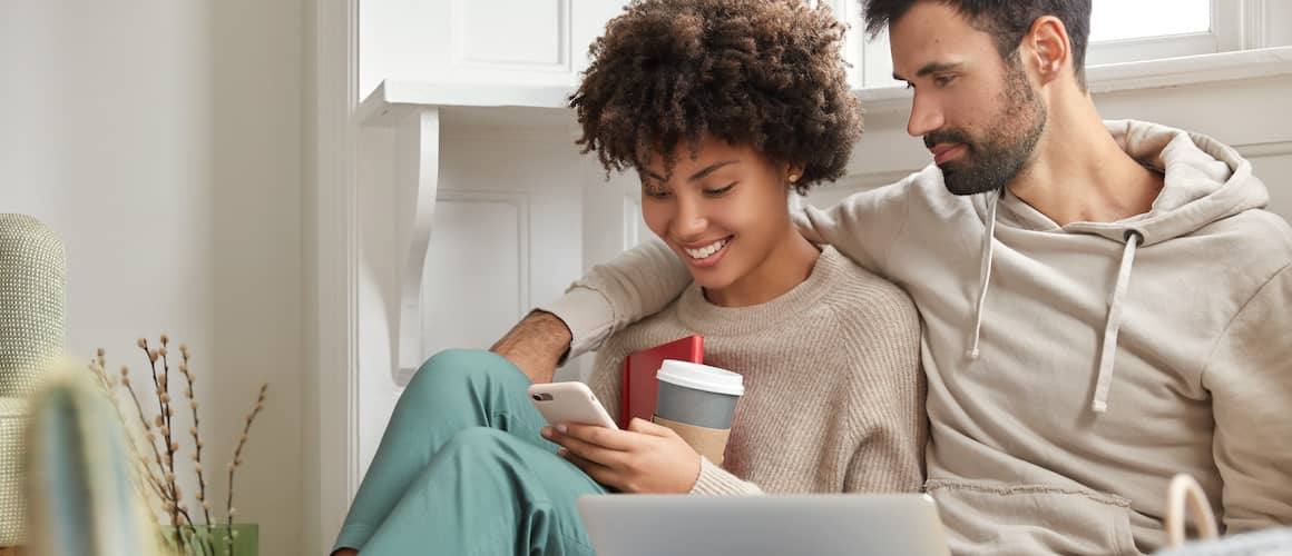 Family sitting on couch in a cozy living room