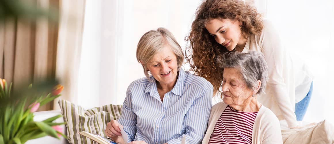 A multi-generational family with a teenage girl, mother, and grandmother at home.