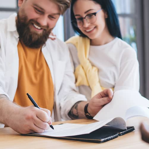 Couple Signing Mortgage