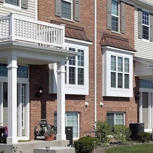 An illustration of a multifamily home, depicting residential housing for multiple families or tenants.