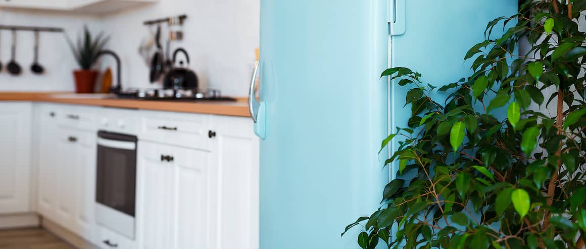 A view of model well designed kitchen with light blue colored fridge.